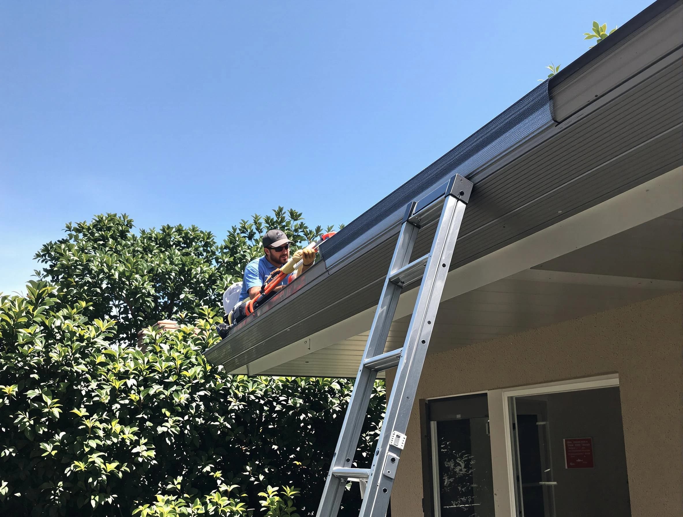 Solon Roofing Company installing gutter guards for a homeowner in Solon, OH